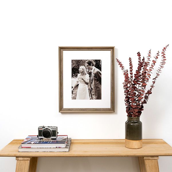 Arlington fluted antique silver frame with black & white wedding photo hanging above entry table